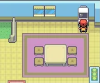 The player standing inside a small home with a table and television.