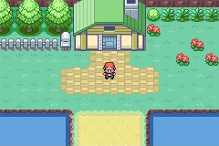 The player standing outside a Pokemon Center between two sections of water.